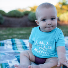 Load image into Gallery viewer, We Are All More Alike Than Different. Baby tee