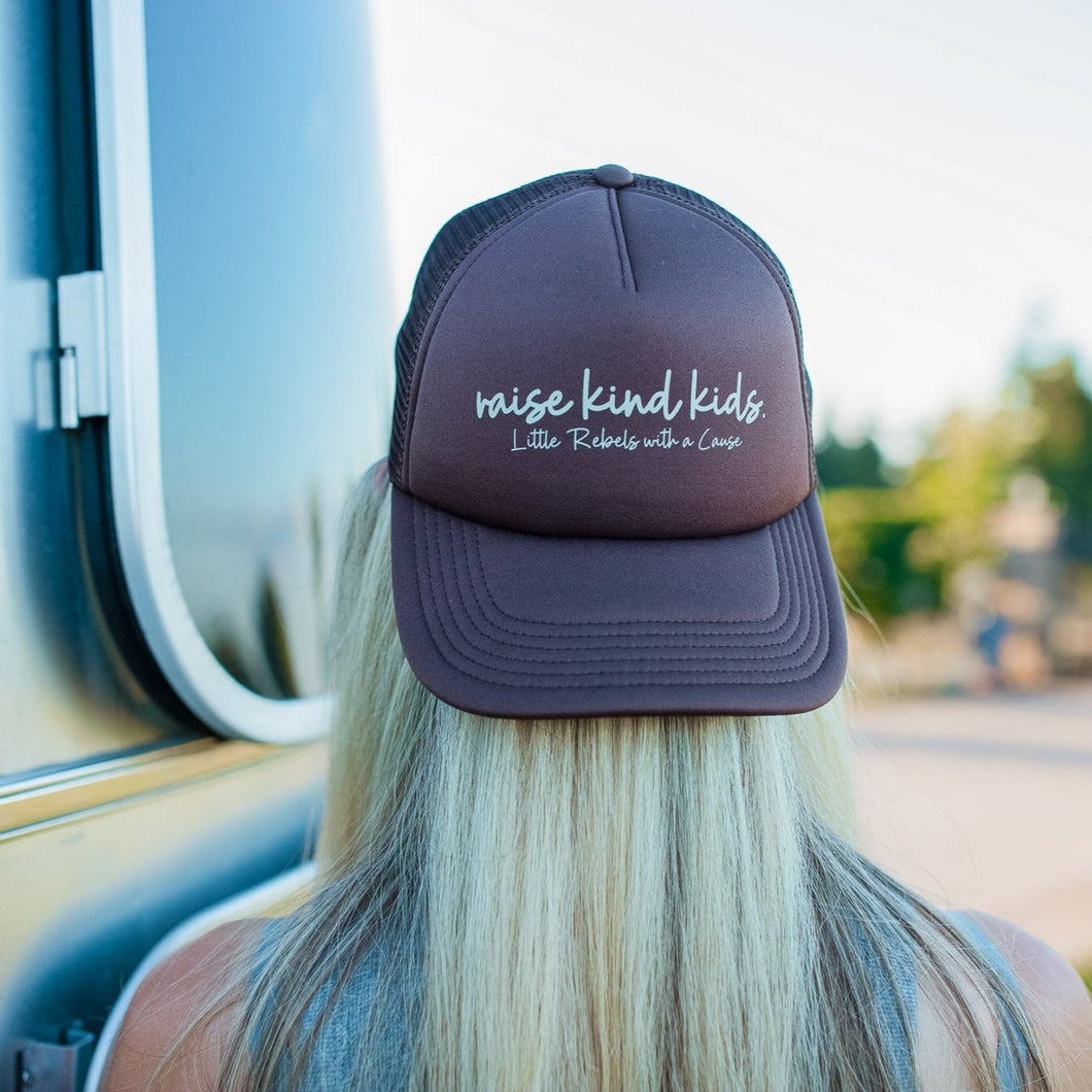 raise kind kids. trucker hat