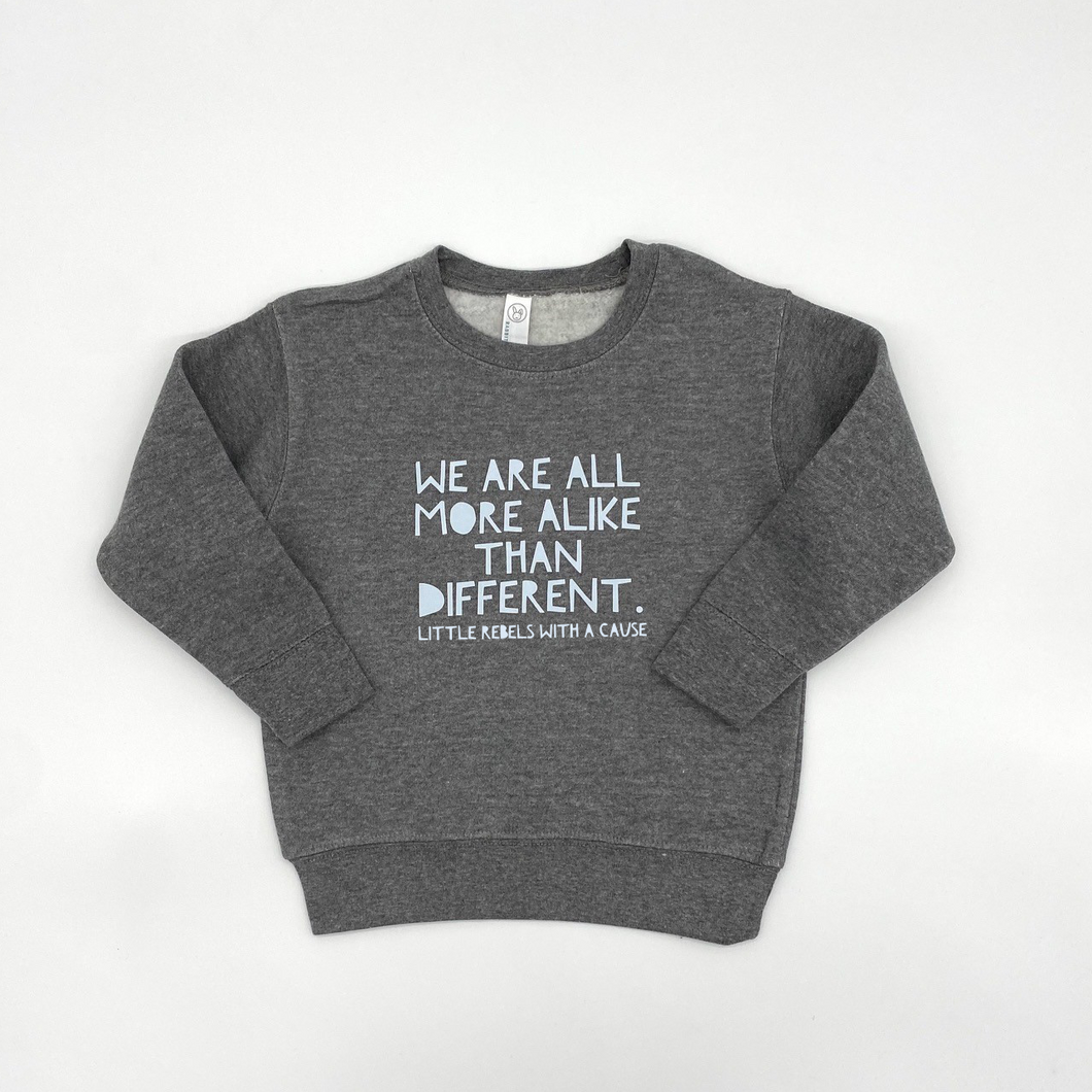 We are all more alike than different. Toddler Sweatshirt