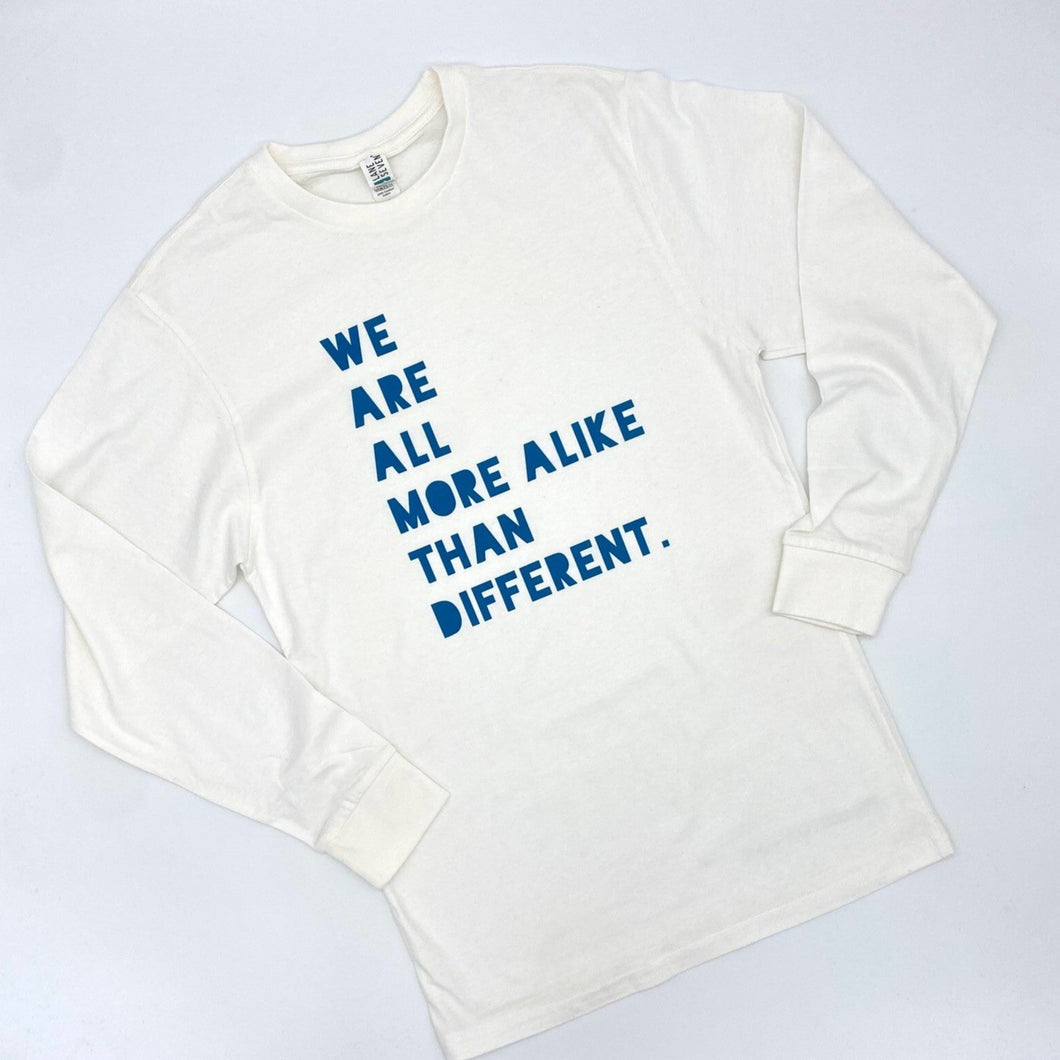 We are all more alike than different. Adult Long Sleeve Crew - White